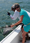 Woman catches a shark