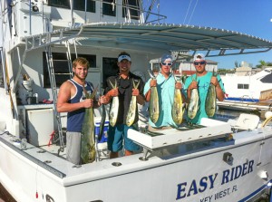 Crew holding up dolphin fish