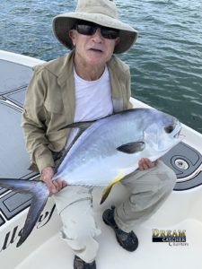 shows angler holding his permit fish that he caught with Dream Catcher Charters